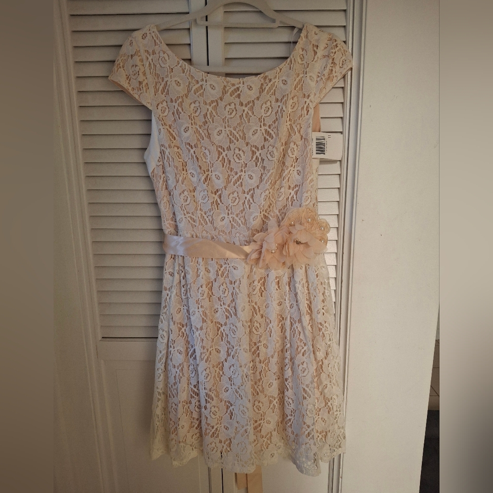 Elegant Lace Dress with Floral Accent